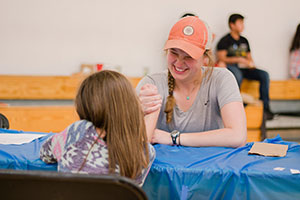 A Whitman student plays with an elementary student.