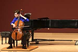 Liam Dubay playing the cello