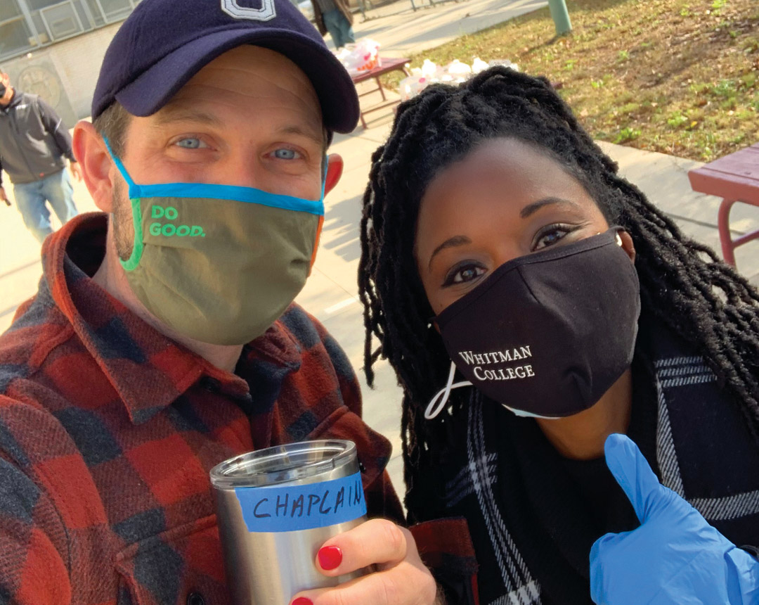Brewster, sporting a Whitman facemask, and Graham Ashcraft, wearing a do good facemask take a picture outside the polling station.