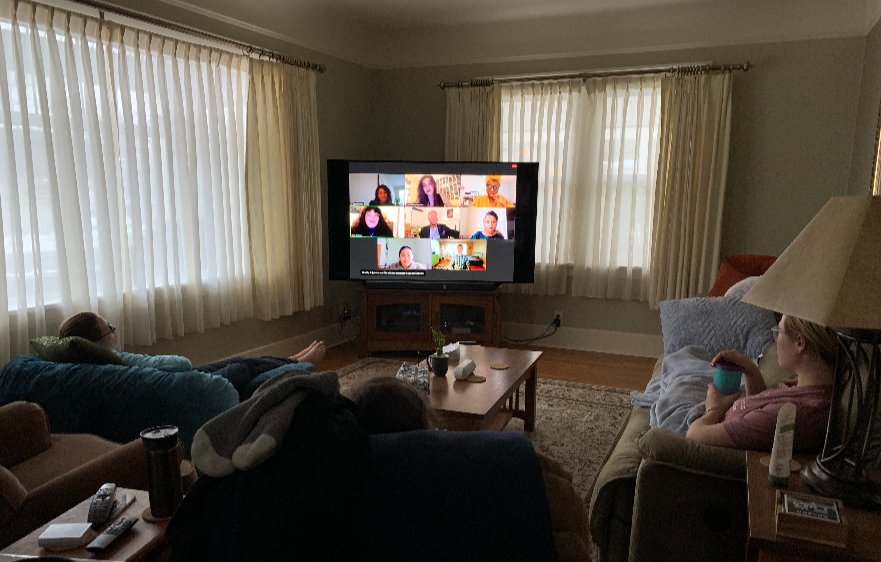 Students gathered around a virtual meeting