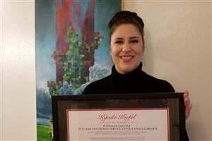 Kynde Kiefel receiving award