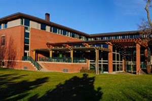 Photo of Reid Campus Center with bright blue sky in the background