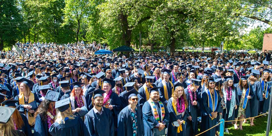 Graduates listening to student speaker Lauren Rhodes ’21 during commencement