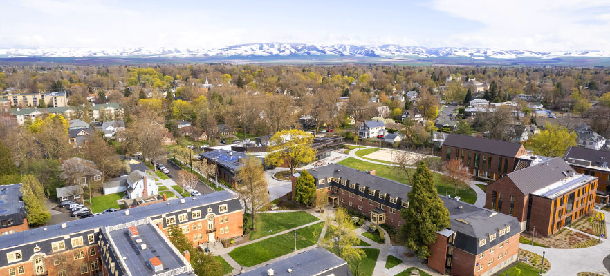 Ariel view of Whitman College campus with mountains in the background
