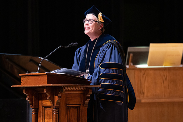 Sarah Bolton smiling at the podium during Installation.