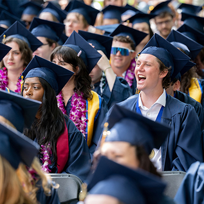 A crowd of Whitman students in graduation gowns and caps.