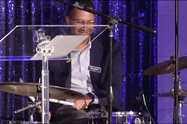 Drew Shoals ’05 plays the drums during the Upward Together celebration.