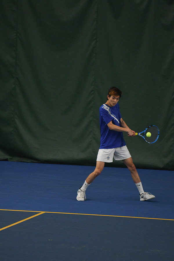 a Whitman men’s tennis player hitting the ball