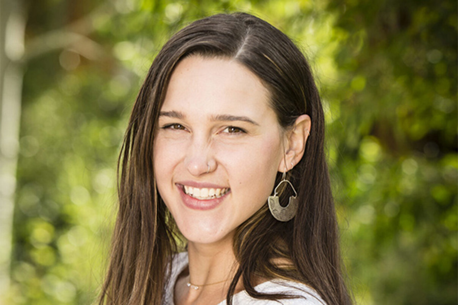 Photo of Katherine Swisher against a background of trees.