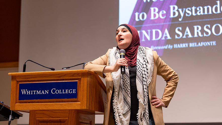 Image of Linda Sarsour presenting in Reid Campus Center.
