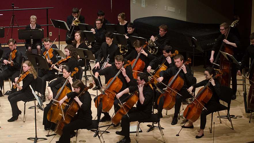 Whitman College's orchestra performing in the Hall of Music. 