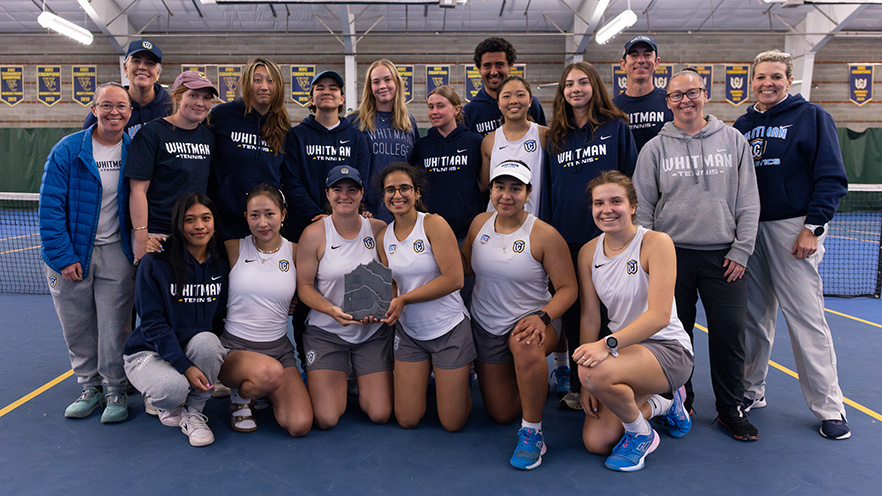 2024-25 Whitman College Women's Tennis team posing with the Northwest Conference Tennis Championship trophy.