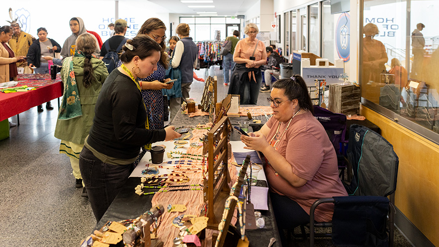 Vendors at Whitman College selling artwork, crafts and food to powwow attendees.
