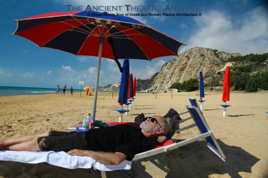 Author resting on the beach between Agrigento and Heraclea Minoa. Scala dei Turchi in the background.