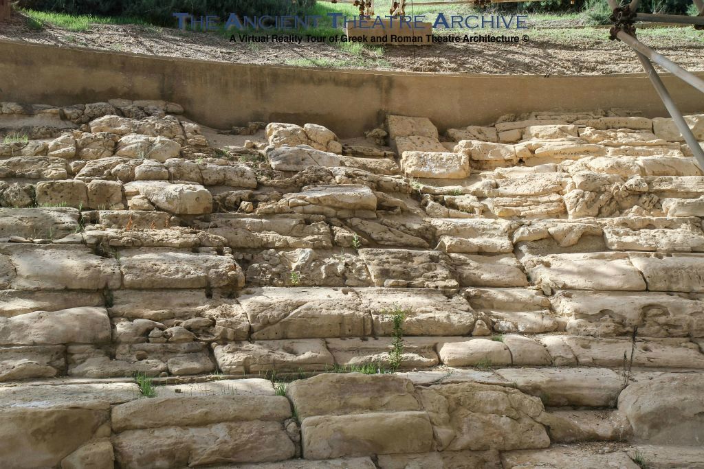 The weathered rows of seats are divided into nine pie-shaped sectors (kerkides) by eight small staircases (klimakes).  Photo: T. Hines 2018.