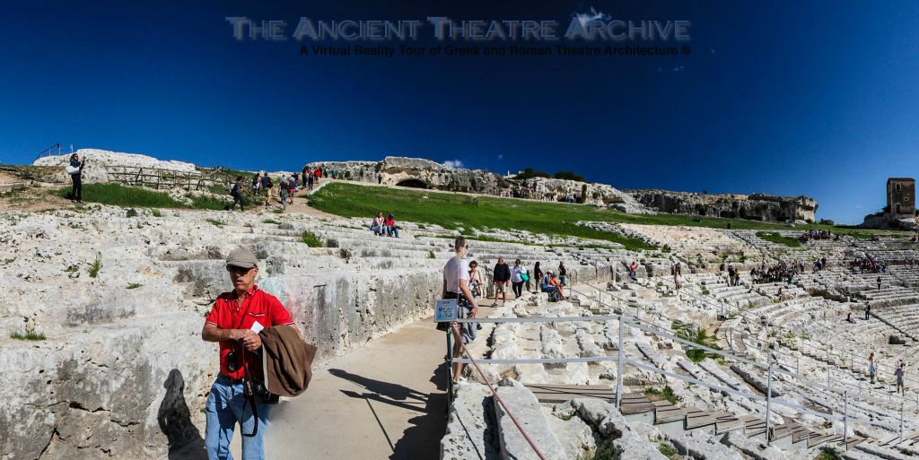 A terrace above and behind the theatre has been carved into the rock and is accessed by a central stairway and by a recessed path, “Via dei Sepolcri” (Street of Tombs).  Photo: T. Hines.