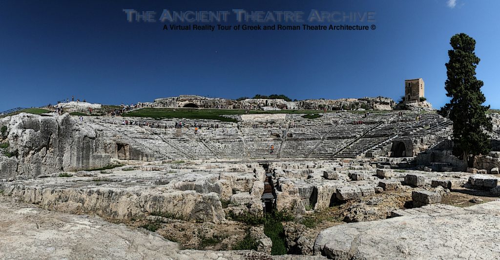 The scene building at Syracusae no longer exists but the foundations remain. Note:  0.9 meter wide and 1.75 meter high passageway (probably from Hieron II’s time) was cut beneath the scene building and extended to the middle of the orchestra.  Photo: T. Hines.